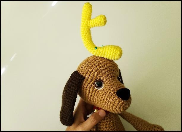 Baby Max reindeer horn and collar close-up detail