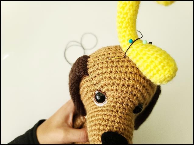 Baby Max dog amigurumi seated side view