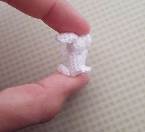 Handcrafted micro crochet bunny with long ears and popcorn feet