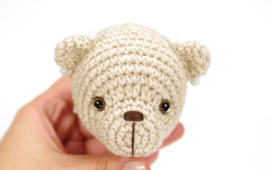 Attaching arms and legs to the crochet teddy bear body with internal button joints