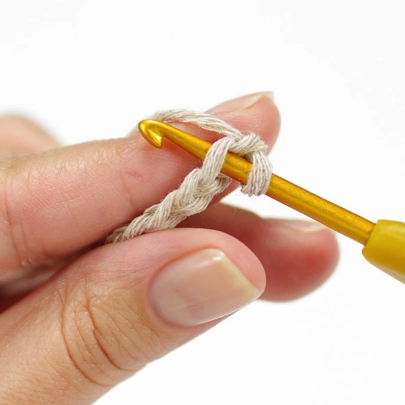 Crocheting around a foundation chain to create a flat oval foot sole for amigurumi bear